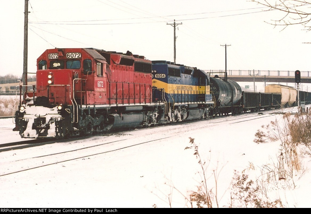 Local heads west behind a pair of Dash-2's